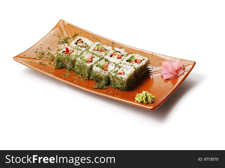 Rolls with dill, tuna and tofu in brown squared plate over white background