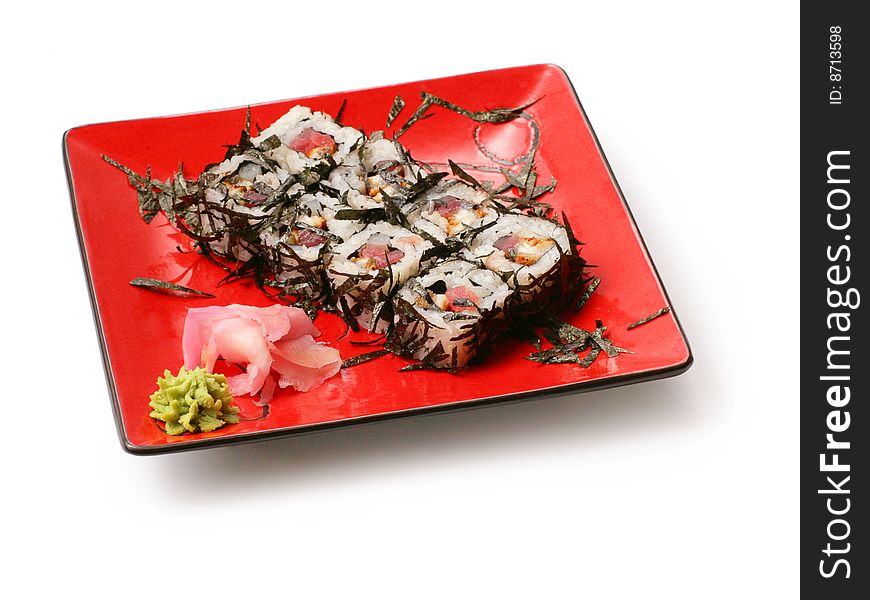 Rolls with seaweed, salmon and octopus in red squared plate over white background