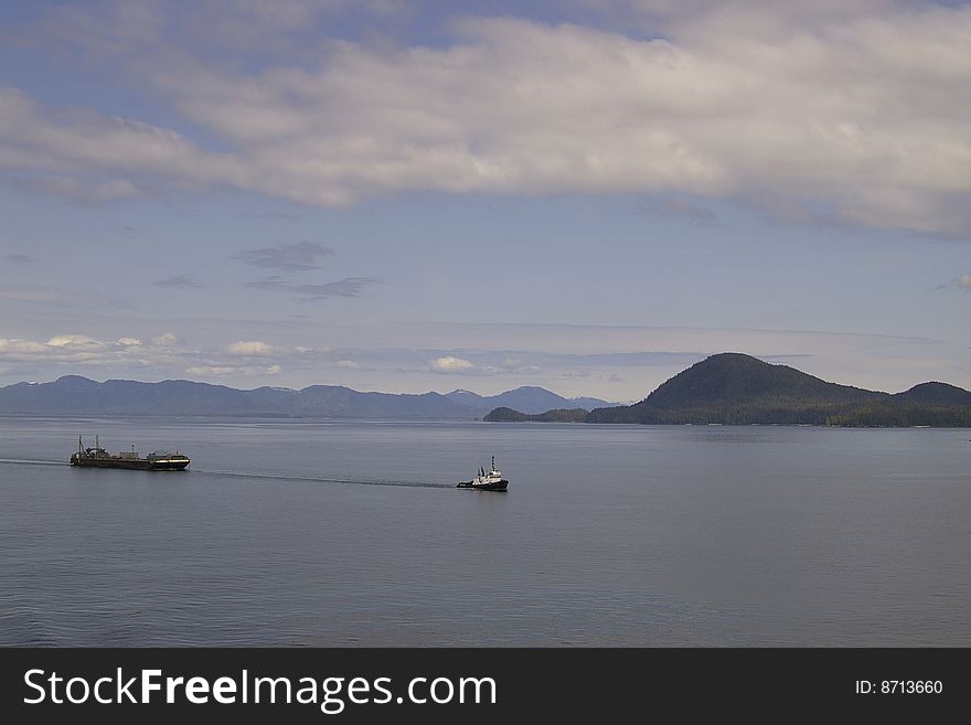 Tug and barge navigate the inside passage in British Columbia