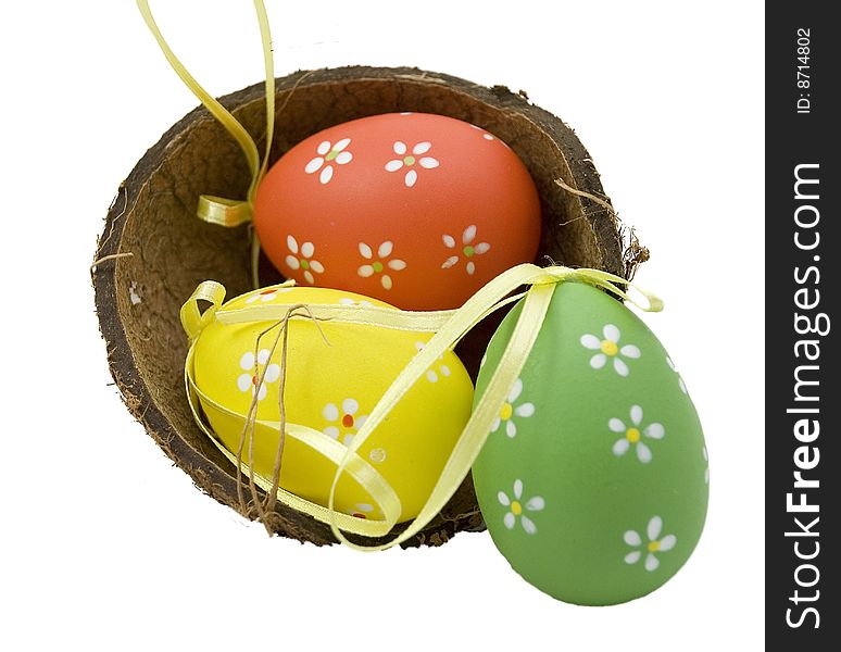 Basket full of Easter eggs - red green yellow.