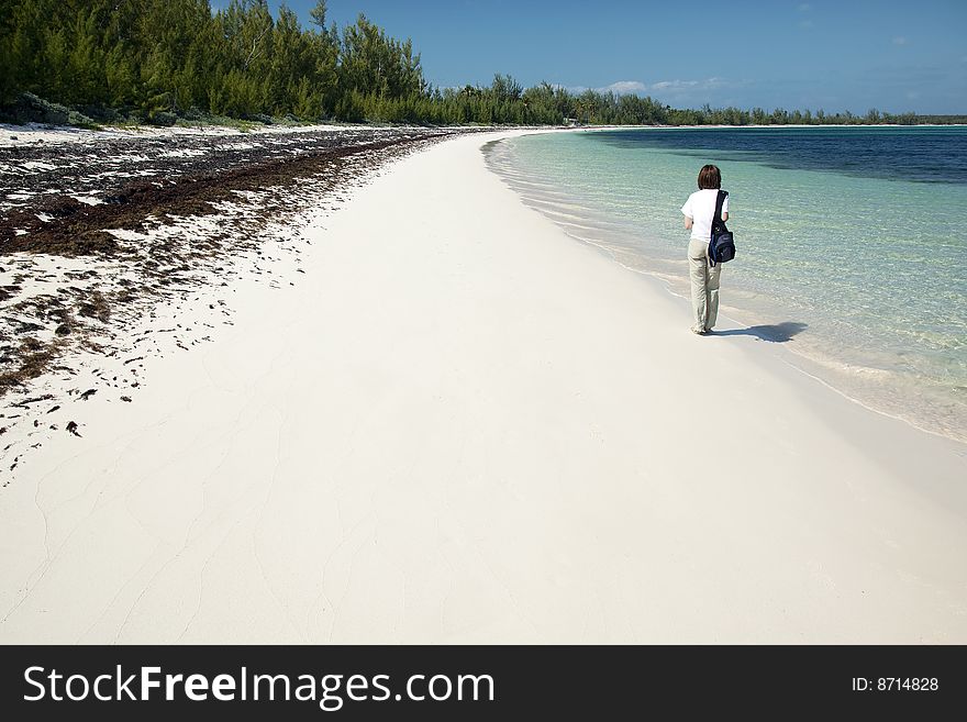 Walking along the Winding Bay Beach in Eleuthera, Bahamas. Walking along the Winding Bay Beach in Eleuthera, Bahamas