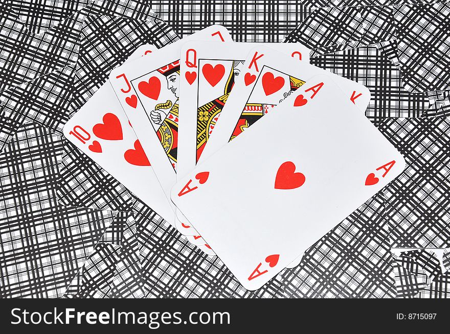 Hearts poker on a playing cards background