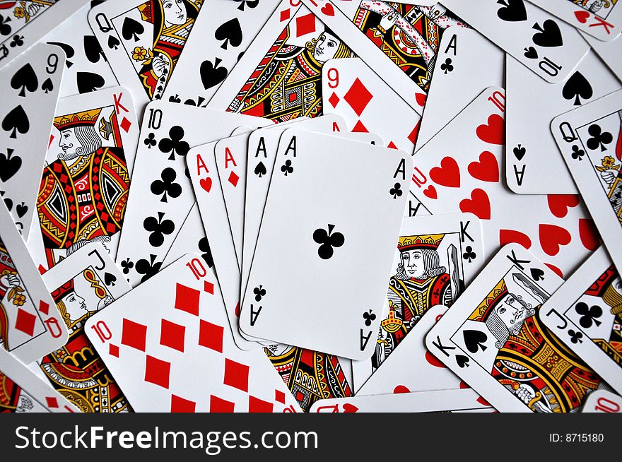 Four aces on a  playing cards background