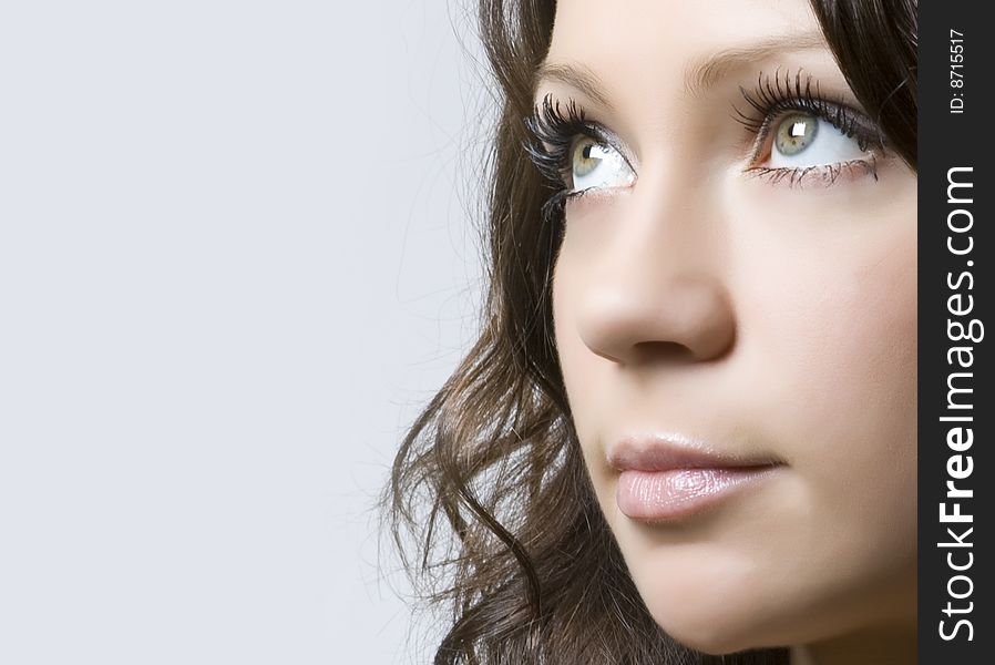 Close-up portrait of a beautiful young brunette. Close-up portrait of a beautiful young brunette
