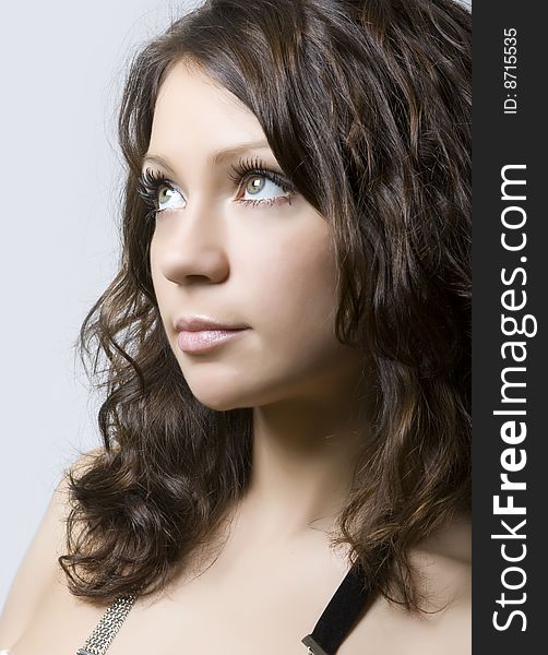 Close-up portrait of a beautiful young brunette. Close-up portrait of a beautiful young brunette