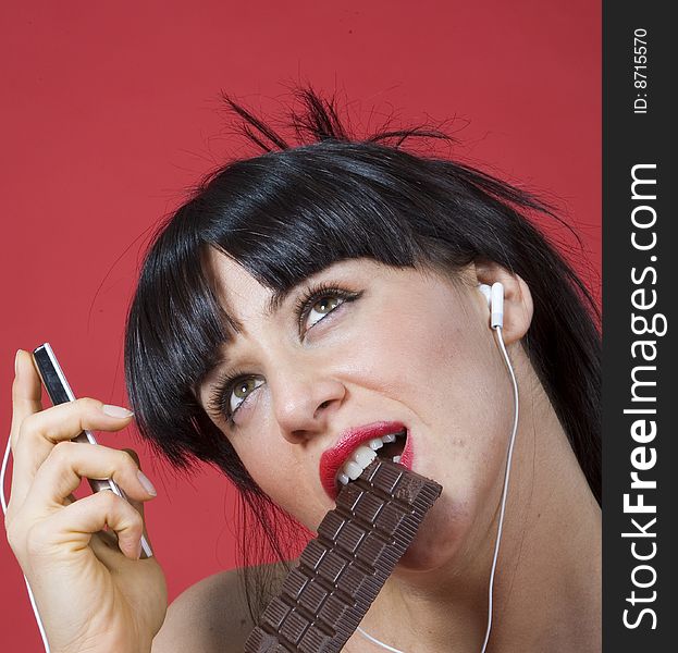 Sensual women who eat chocolate and listen to music