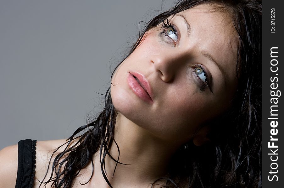 Beautiful wet brunette portrait in studio shot