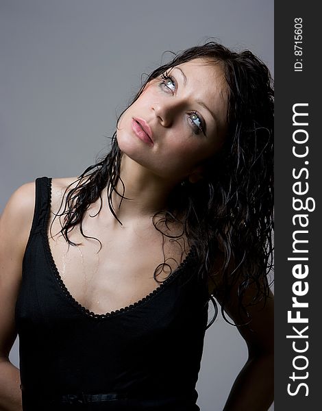 Beautiful wet brunette portrait in studio shot