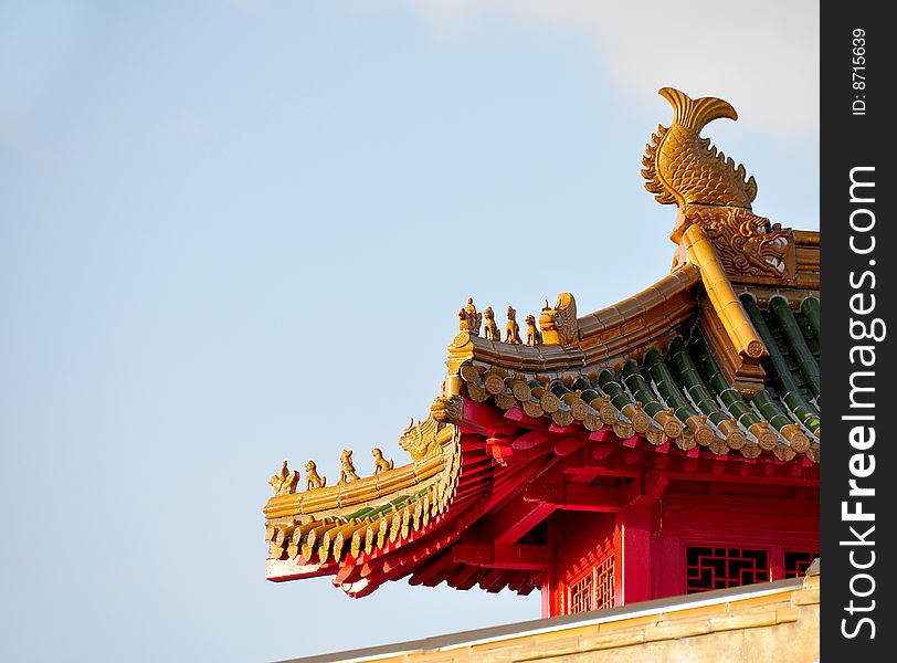 Traditional detail of a chinese roof with guarding lions and warriors