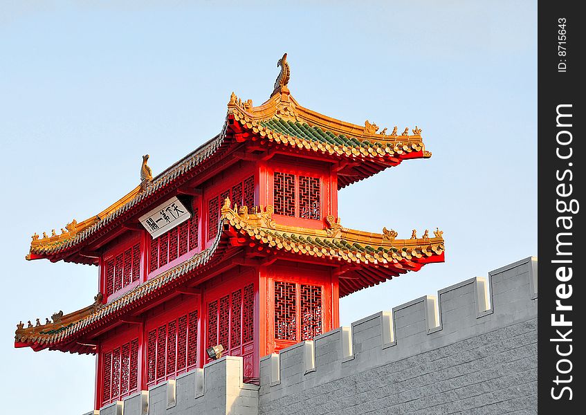 Traditional detail of a chinese roof with guarding lions and warriors