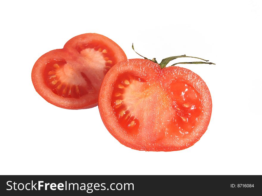 Half of fresh tomato of red color on a white background.