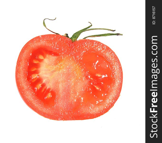 Half of fresh tomato of red color on a white background.