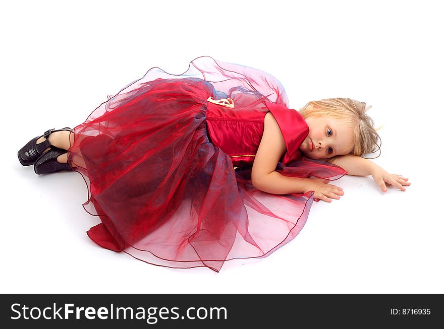 Portrait of the beautiful girl in a red dress