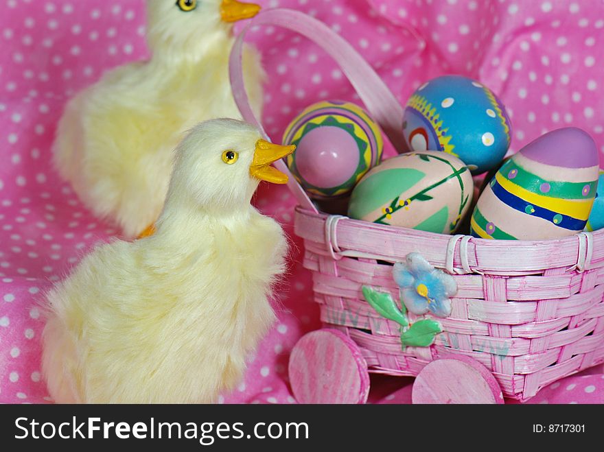 Ducklings with Easter eggs in buggy. Ducklings with Easter eggs in buggy.