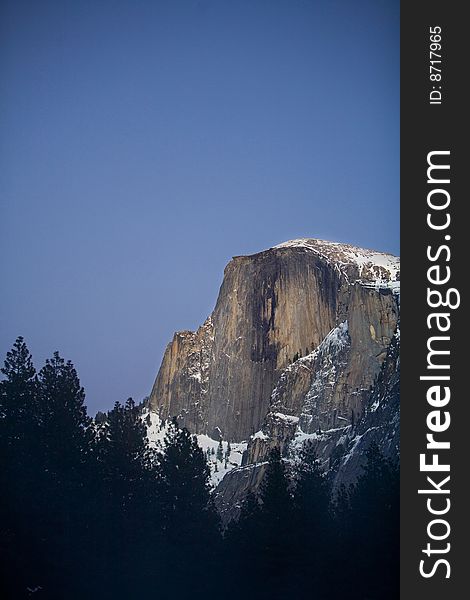 Half Dome in Yosemite National Park during winter in twilight. Half Dome in Yosemite National Park during winter in twilight