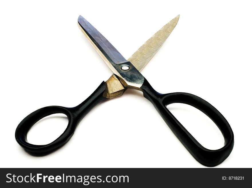 Close-up of a scissors isolated over white. Close-up of a scissors isolated over white