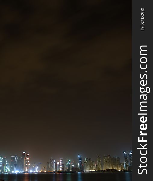 View of dubai marina through the fog from the palm island