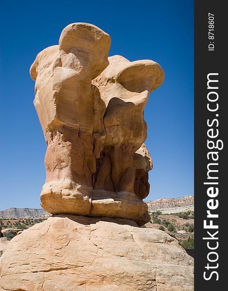 Red rock formation stand against a blue sky. Red rock formation stand against a blue sky