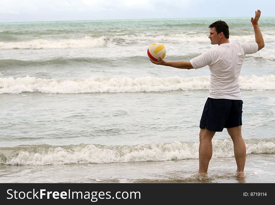 Man holding volleyball and inviting to play. Man holding volleyball and inviting to play