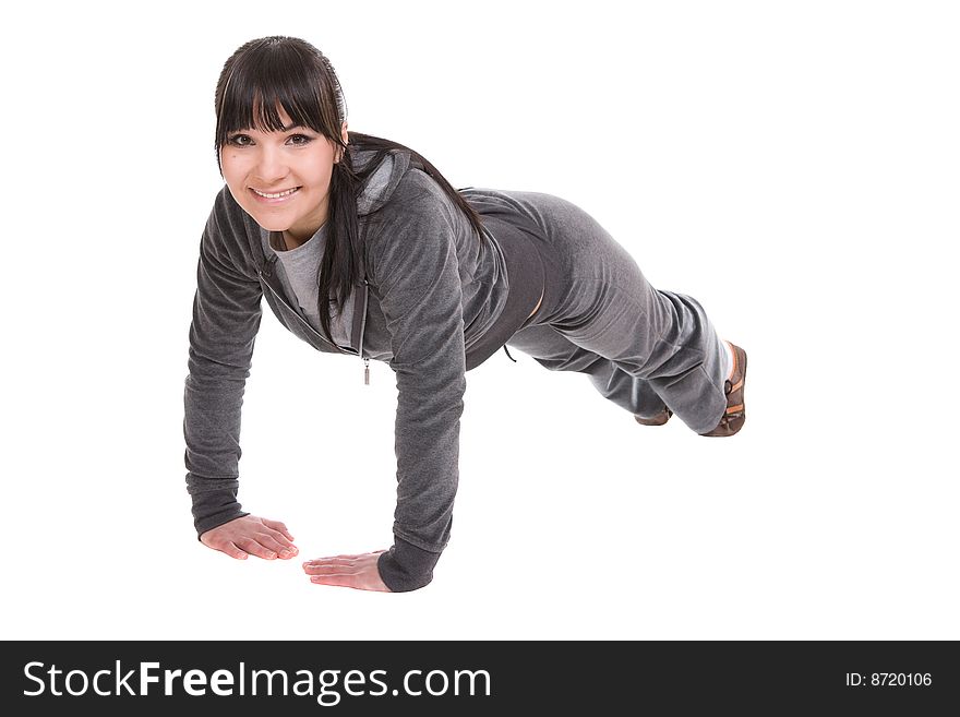 Attractive brunette woman doing exercise. over white background