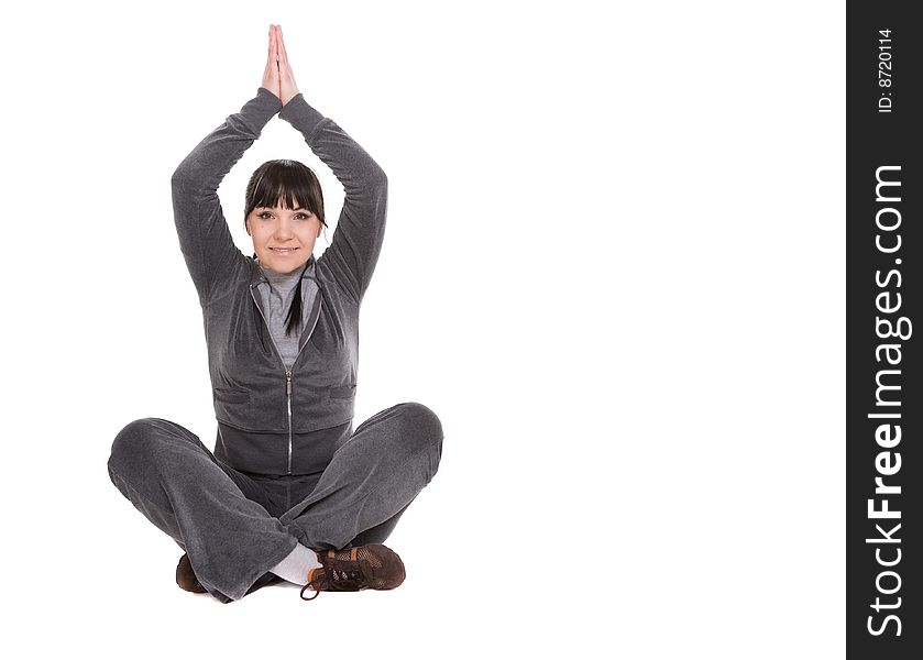 Attractive brunette woman doing exercise. over white background