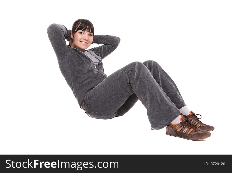 Attractive brunette woman doing exercise. over white background