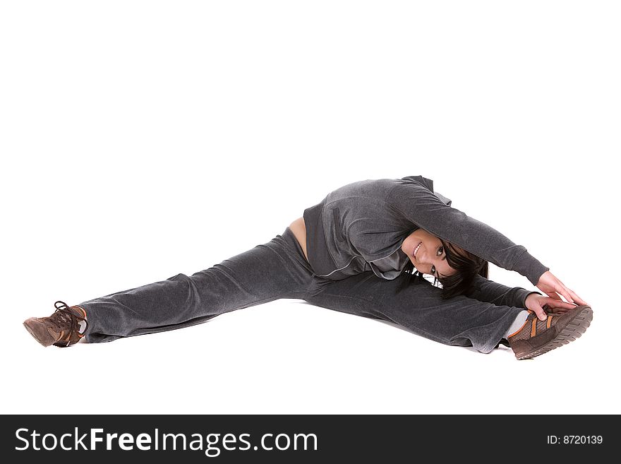 Attractive brunette woman doing exercise. over white background