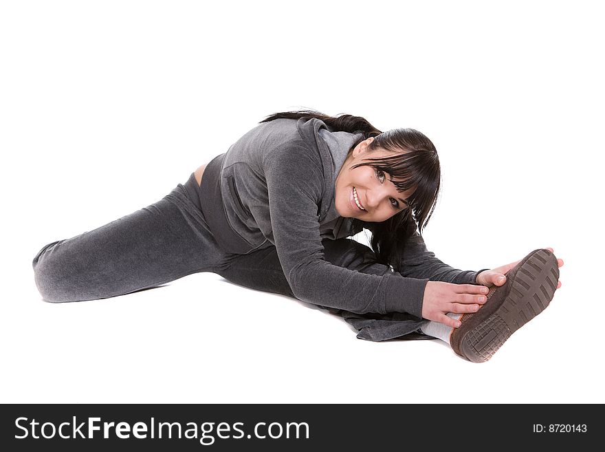 Attractive brunette woman doing exercise. over white background