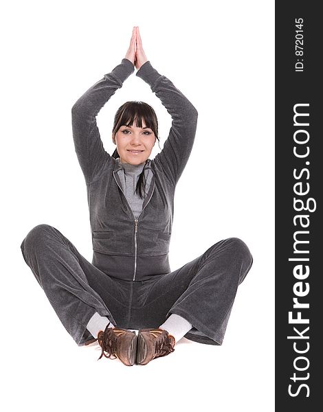 Attractive brunette woman doing exercise. over white background