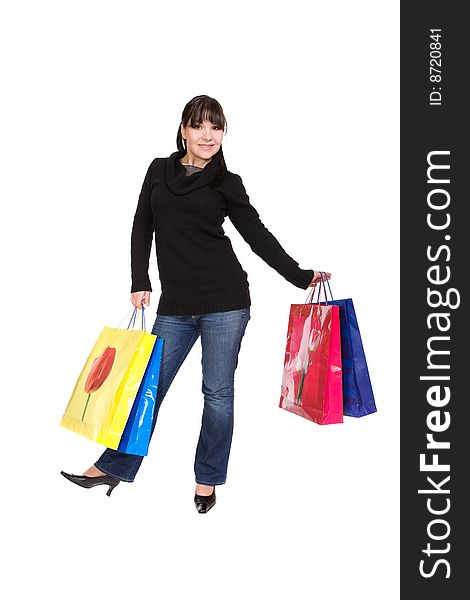 Happy woman with shopping bags. over white background