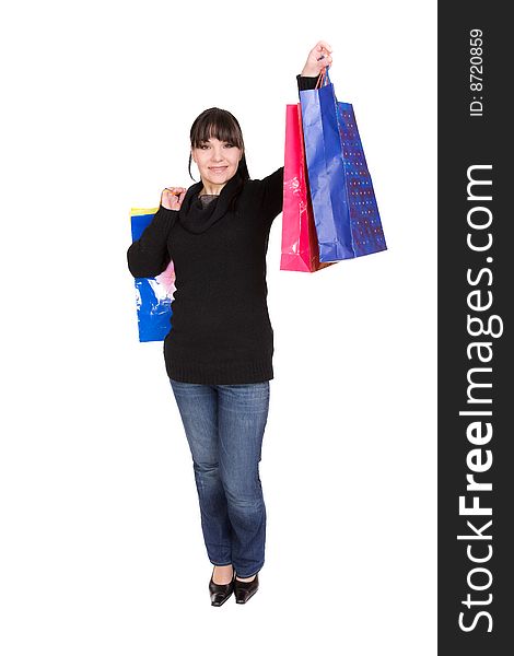 Happy woman with shopping bags. over white background