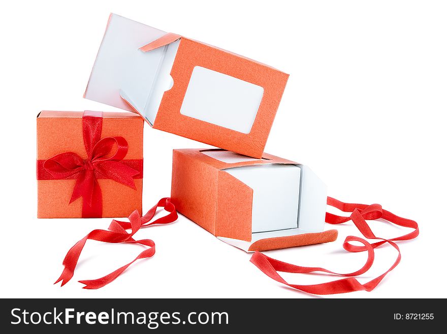 Orange box with red ribbon on white background