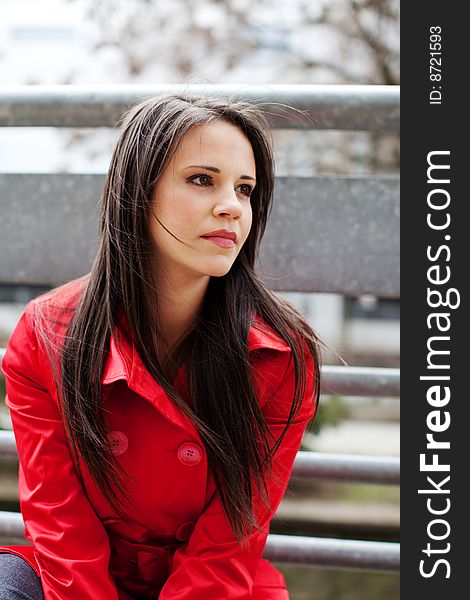 Beautiful young businesswoman in red coat. Beautiful young businesswoman in red coat