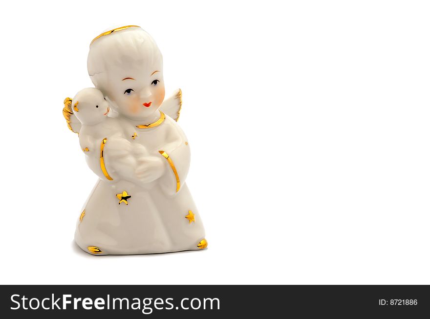 A porcelain angel with white small bear. A porcelain angel with white small bear.