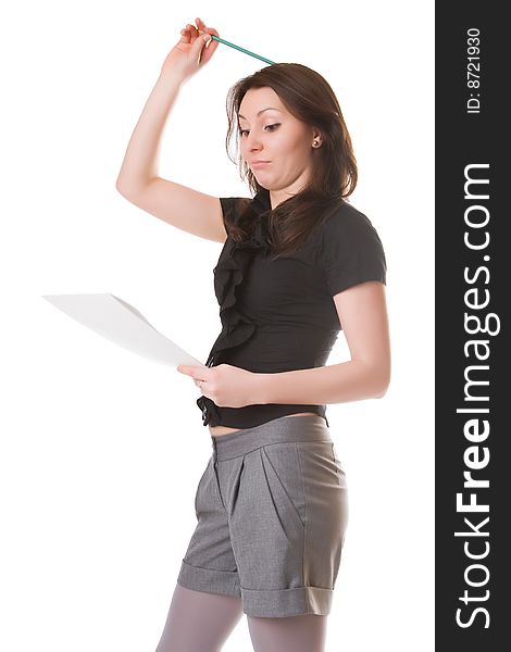 Thoughtful girl with a notebook and a pencil isolated on a white background