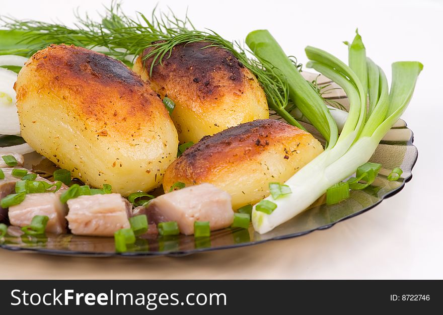 Image of baked potato with slices of a salty herring
