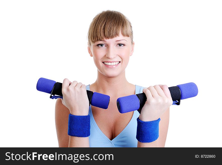 Portrait of young attractive girl with dumbbells in her hands