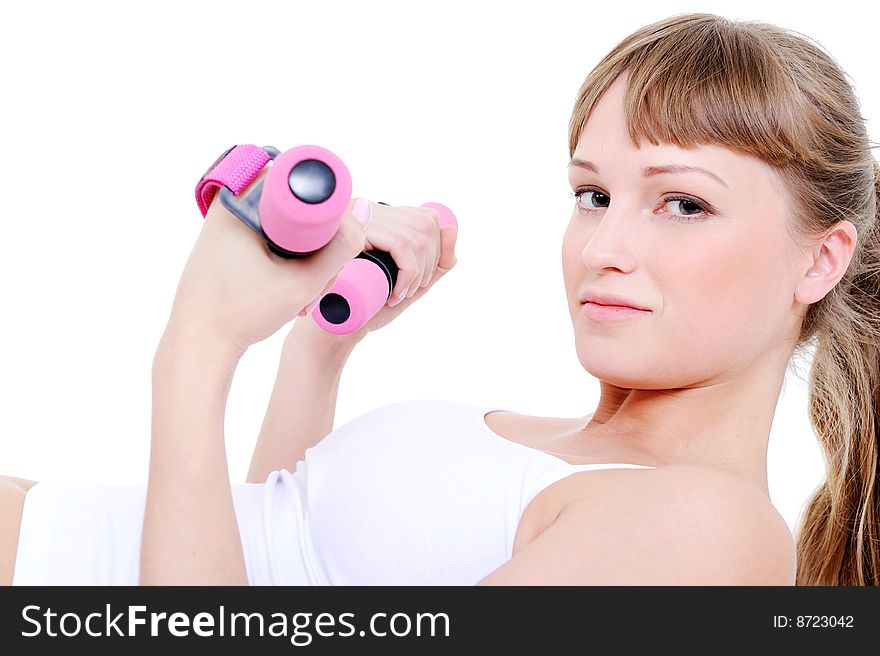 Beautiful woman with dumbbells in her hands