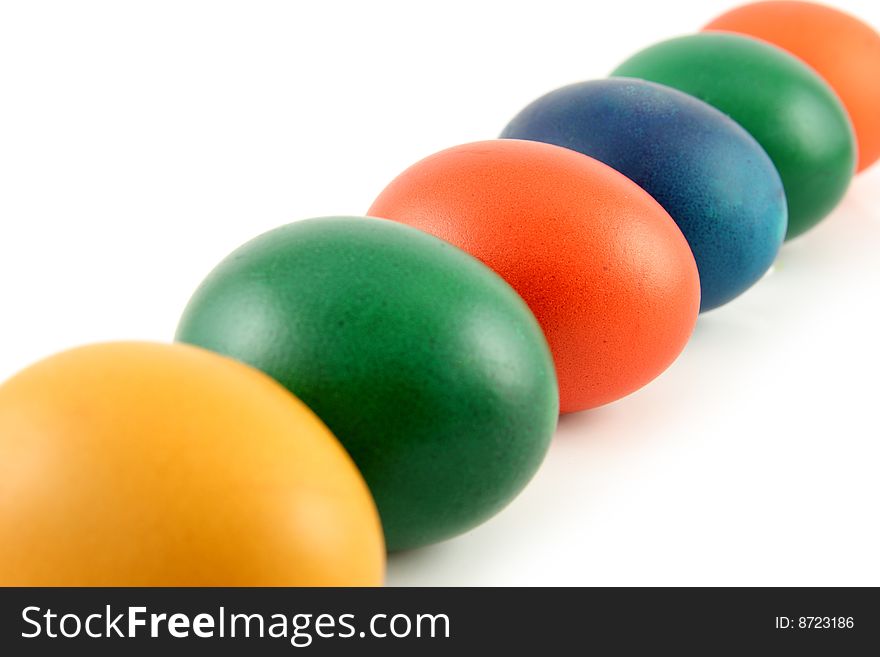 Six colored eggs isolated over white background. Six colored eggs isolated over white background