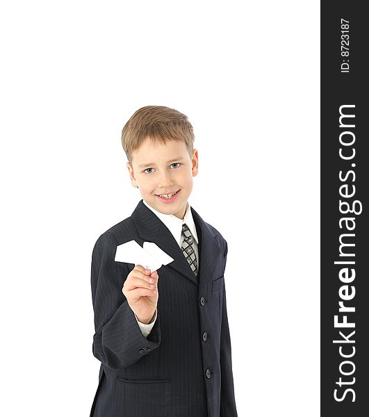 Boy in a suit starts paper plane. Boy in a suit starts paper plane