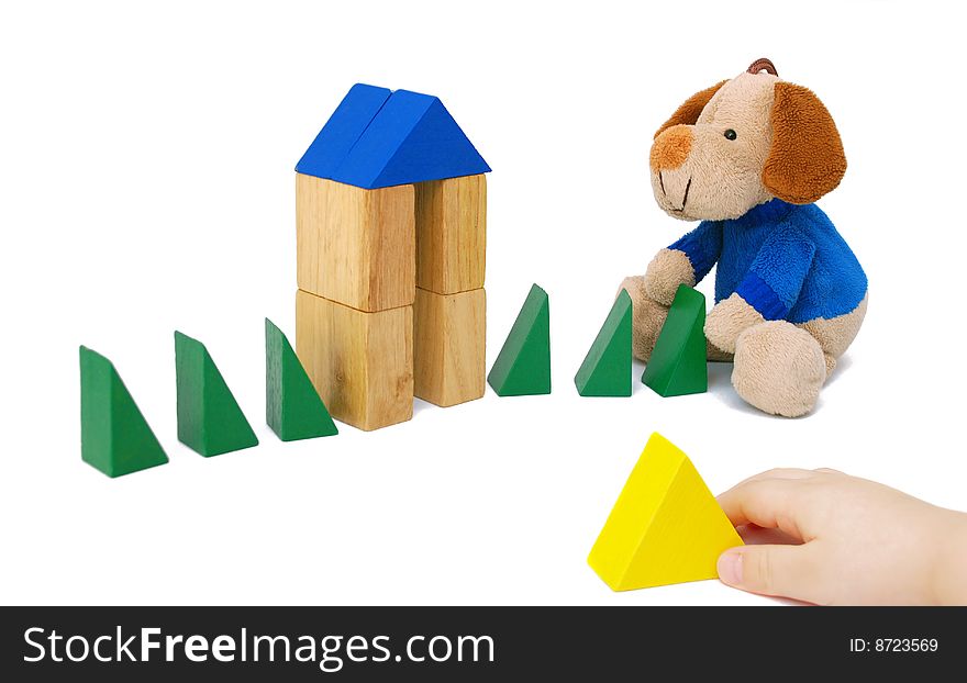 Wooden blocks and a toy on a white background. Wooden blocks and a toy on a white background