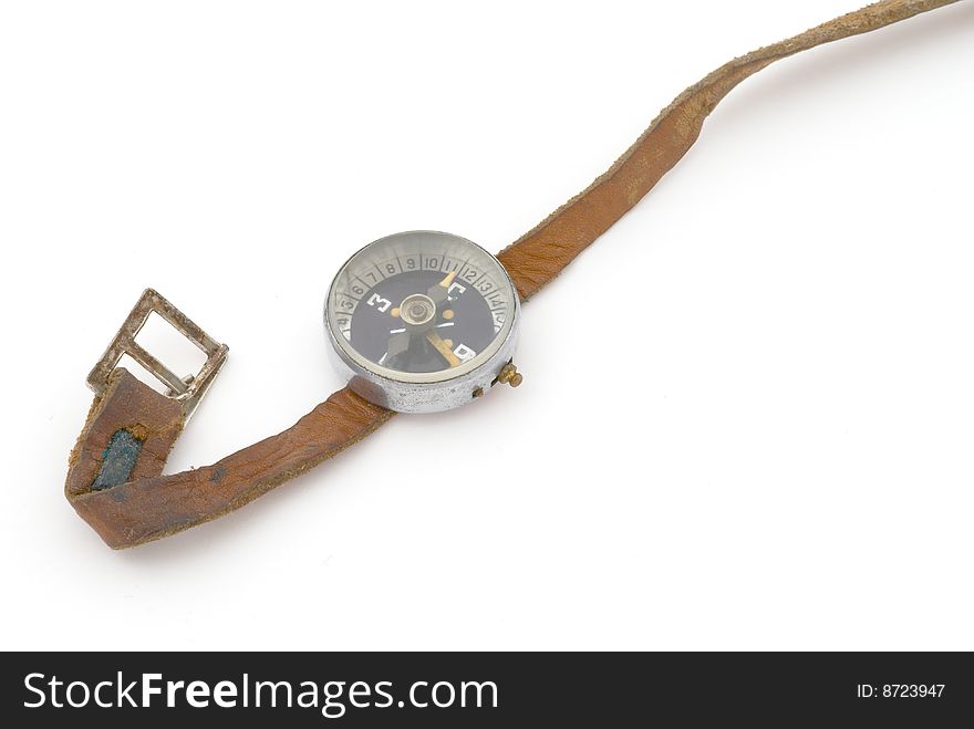 Old compass with brown leather band. Selective focus
