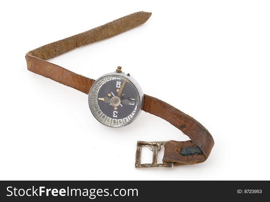 Old compass with brown leather band. Selective focus