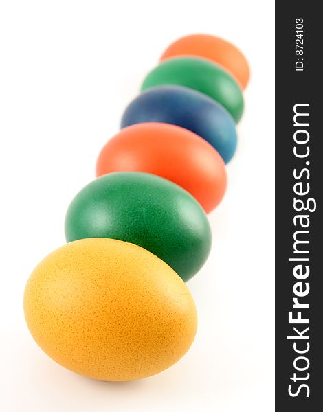 Six colored eggs isolated over white background. Six colored eggs isolated over white background
