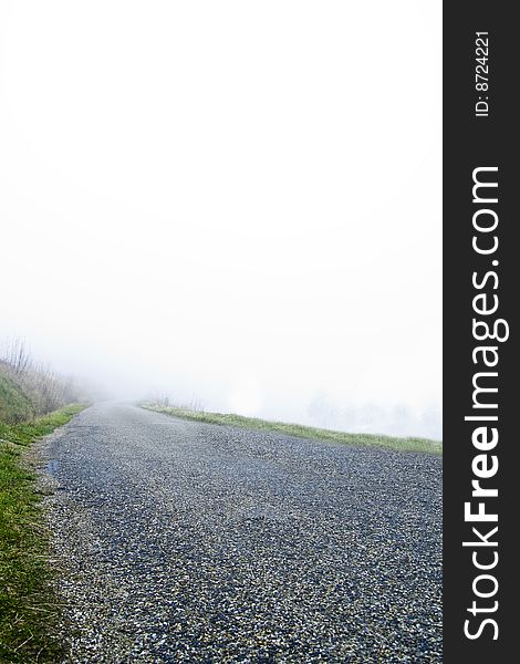 Misty road in the countryside, looks like it lead to nowhere