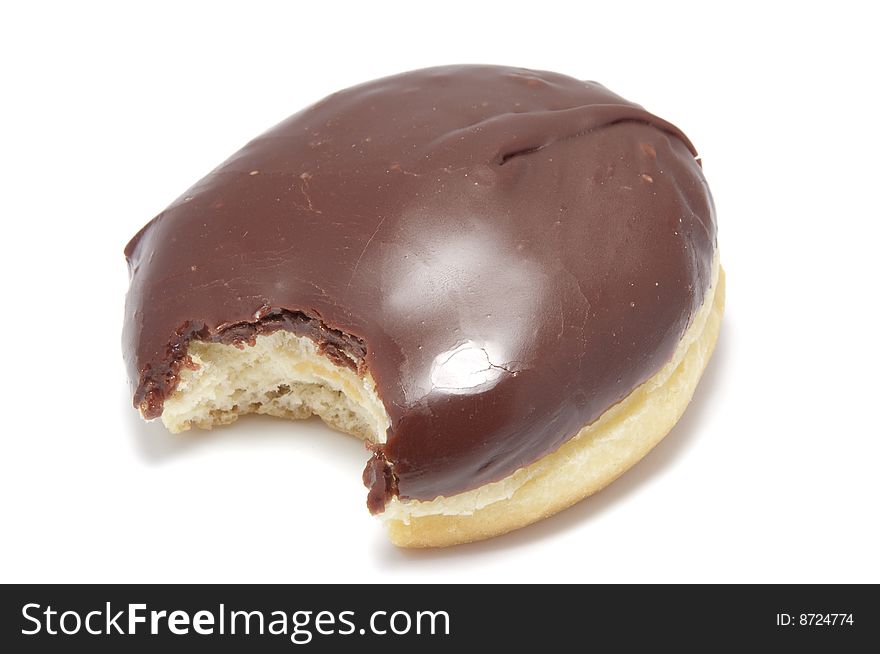 A boston cream filled donut isolated on white. A boston cream filled donut isolated on white.