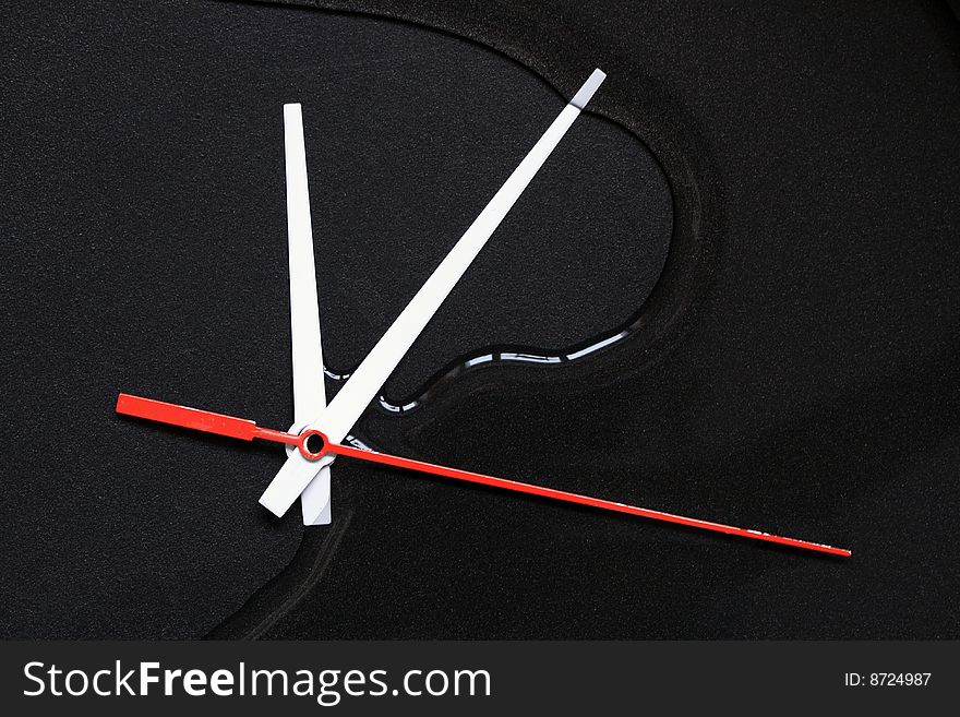 Clock hands lying on dark background with water. Clock hands lying on dark background with water