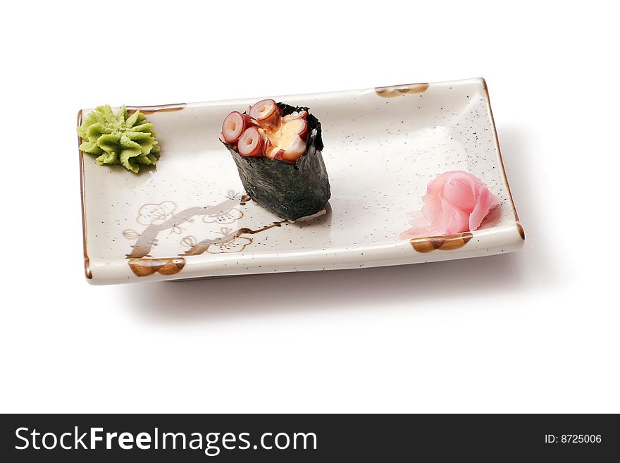 Sushi with octopus and ginger in white squared plate over white background