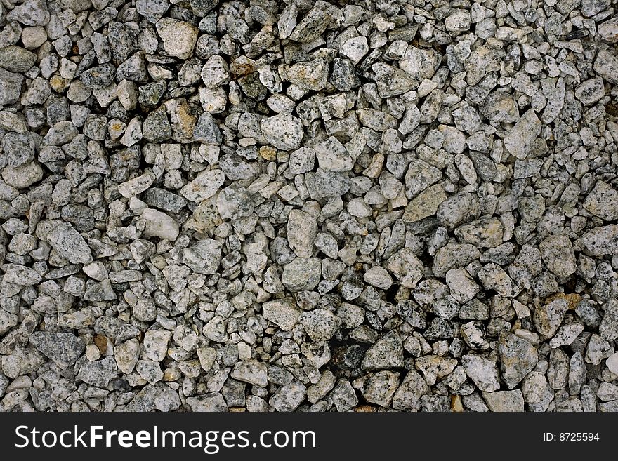 Pebbles of various sizes strewn from ignored grounds