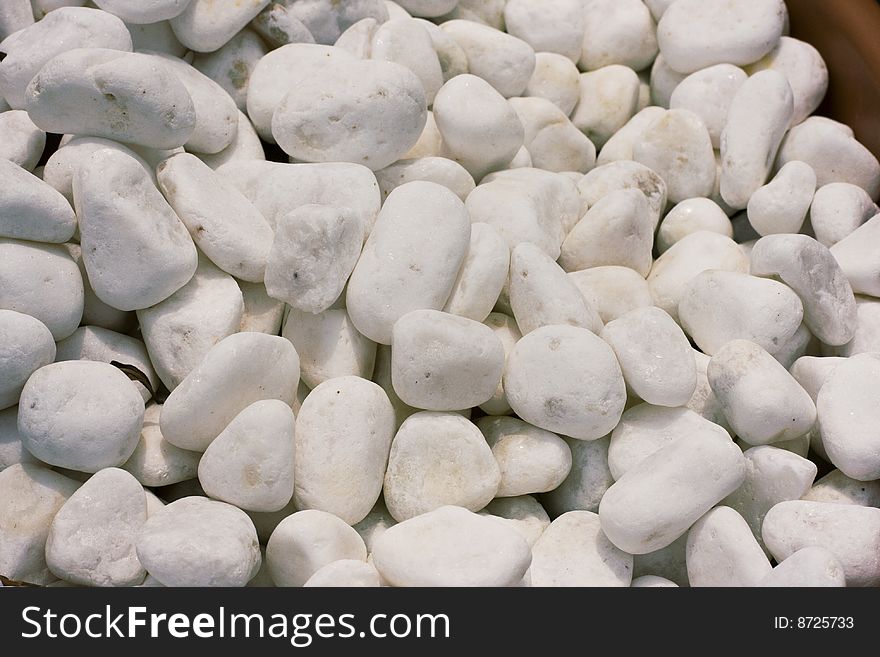 Whitewashed polished faces of white pebbles. Whitewashed polished faces of white pebbles